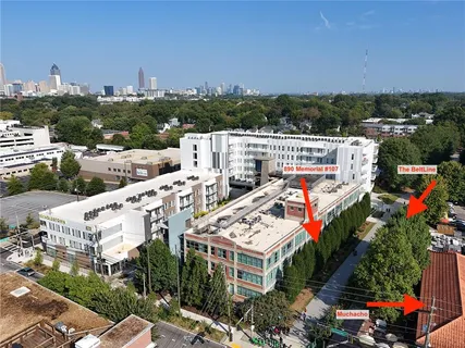a view of multiple houses with a city view