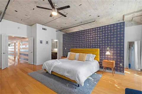 a backyard of a house with lots of green space and fountain