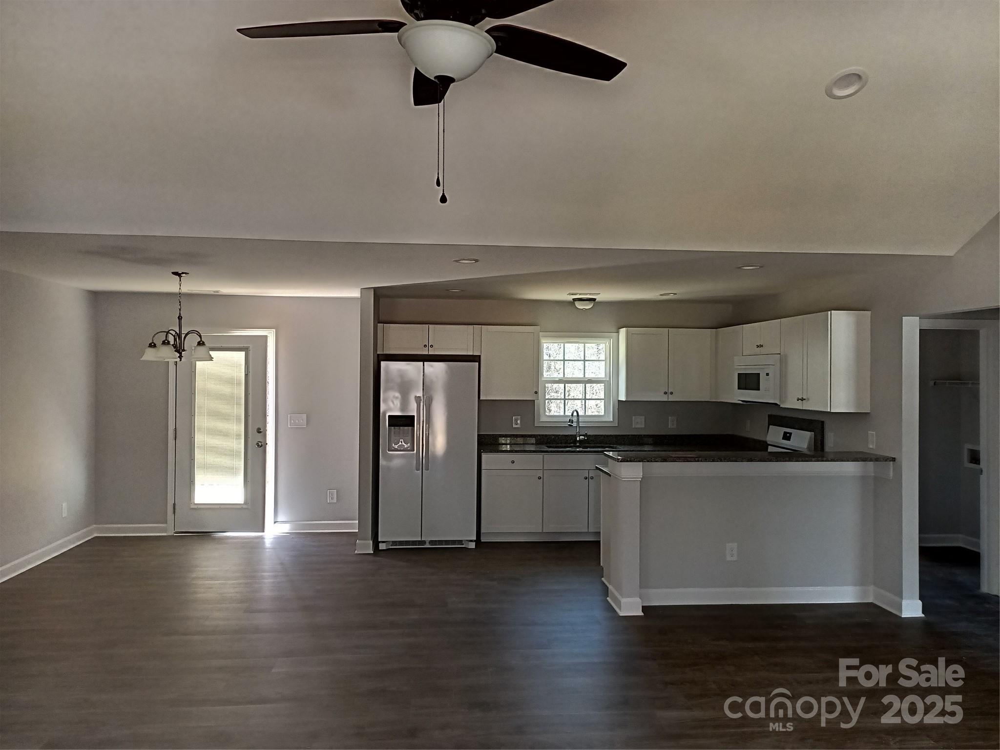 247 North Burris Road Sharon, SC 29742 - Photo 2 of 19 a kitchen with stainless steel appliances granite countertop a stove a sink and a refrigerator