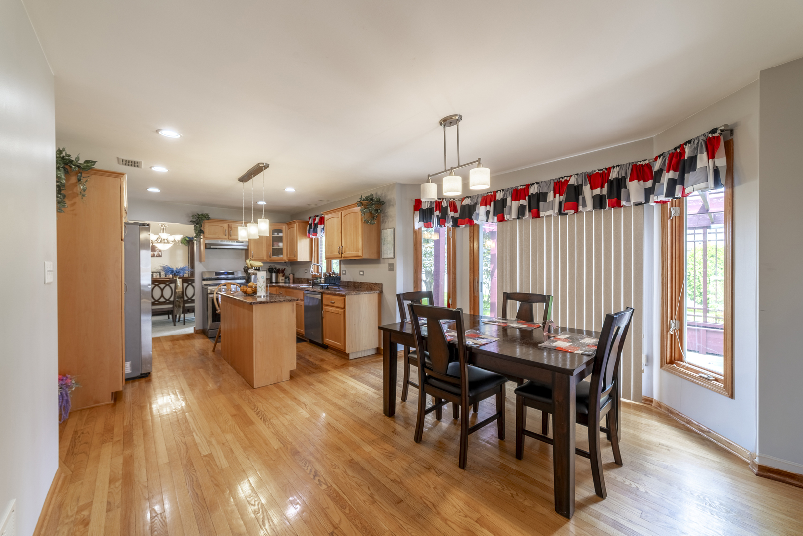 1071 Yamma Ridge New Lenox, IL 60451 - Photo 12 of 51 a view of a dining room with furniture window and wooden floor