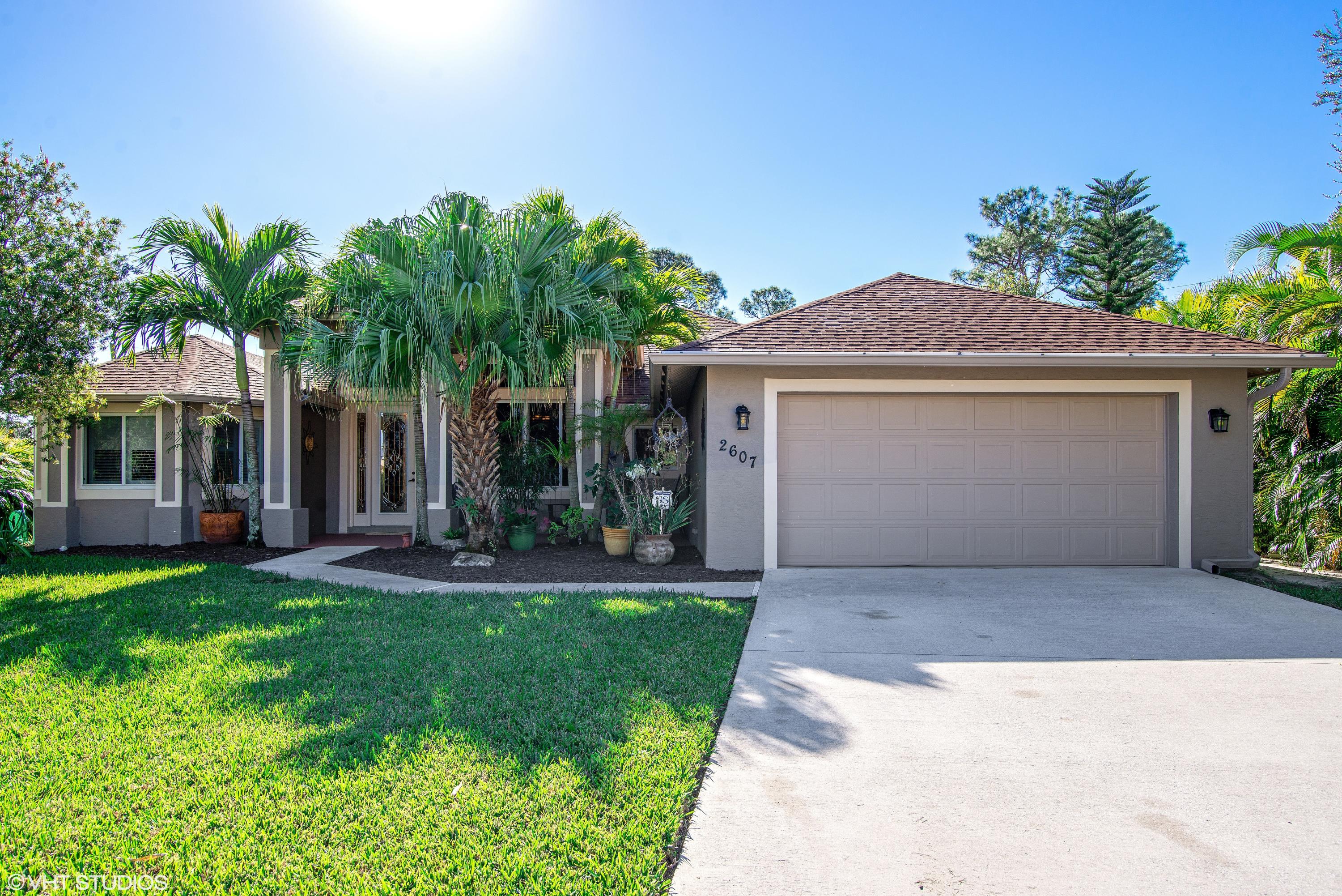 2607 Southwest Acco Road Port St. Lucie, FL 34953 - Photo 1 of 14 Front