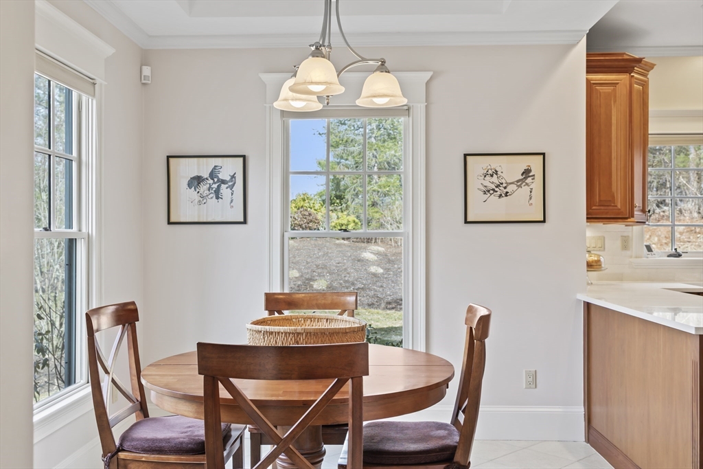 30 Nobscot Road, Unit 1 Sudbury, MA 01776 - Photo 12 of 42 a view of a dining room with furniture window and wooden floor