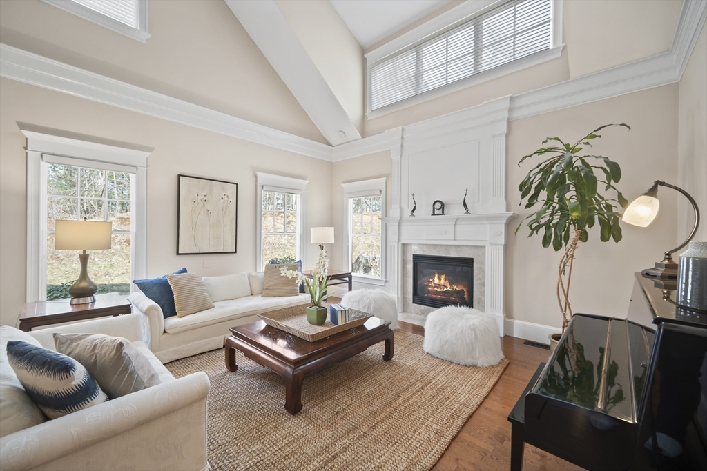 30 Nobscot Road, Unit 1 Sudbury, MA 01776 - Photo 14 of 42 a living room with furniture and a fireplace