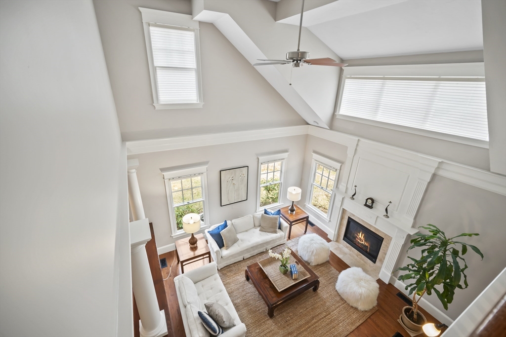 30 Nobscot Road, Unit 1 Sudbury, MA 01776 - Photo 15 of 42 a living room with furniture a fireplace and a potted plant