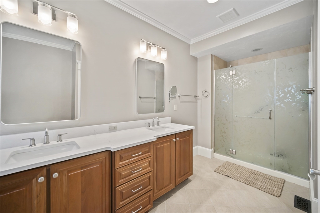 30 Nobscot Road, Unit 1 Sudbury, MA 01776 - Photo 24 of 42 a bathroom with a granite countertop sink mirror and double