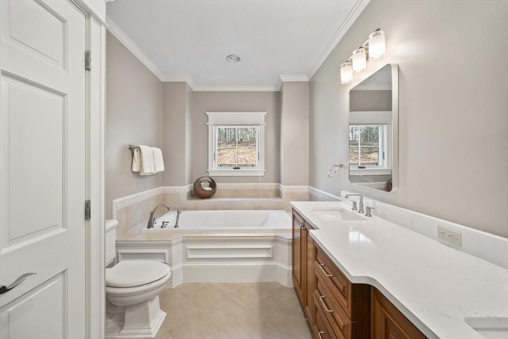 30 Nobscot Road, Unit 1 Sudbury, MA 01776 - Photo 25 of 42 a spacious bathroom with a bathtub sink and toilet