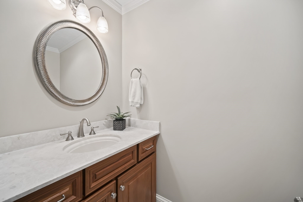 30 Nobscot Road, Unit 1 Sudbury, MA 01776 - Photo 27 of 42 a bathroom with a sink and a mirror