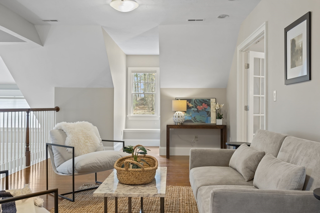 30 Nobscot Road, Unit 1 Sudbury, MA 01776 - Photo 30 of 42 a living room with furniture and a flat screen tv