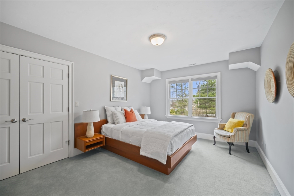 30 Nobscot Road, Unit 1 Sudbury, MA 01776 - Photo 36 of 42 a bedroom with a bed and a couch