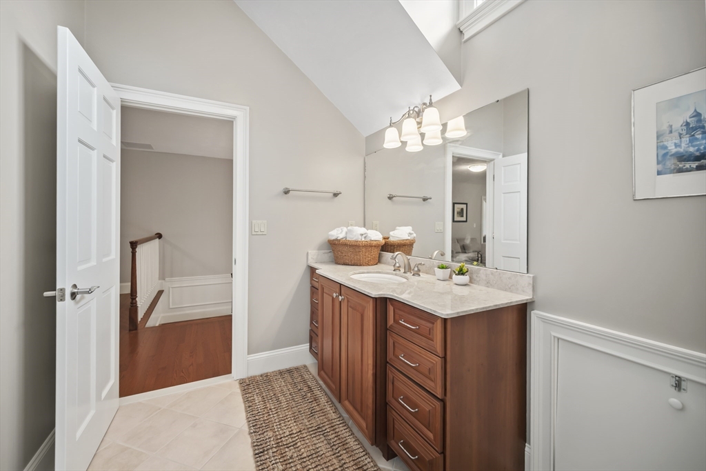 30 Nobscot Road, Unit 1 Sudbury, MA 01776 - Photo 37 of 42 a bathroom with a sink a mirror and a shower