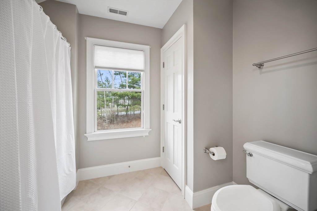 30 Nobscot Road, Unit 1 Sudbury, MA 01776 - Photo 39 of 42 a bathroom with a toilet and a shower