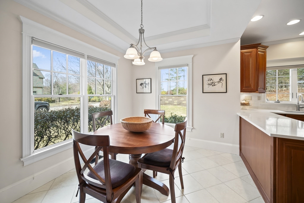 30 Nobscot Road, Unit 1 Sudbury, MA 01776 - Photo 10 of 42 a view of a dining room with furniture window and outside view