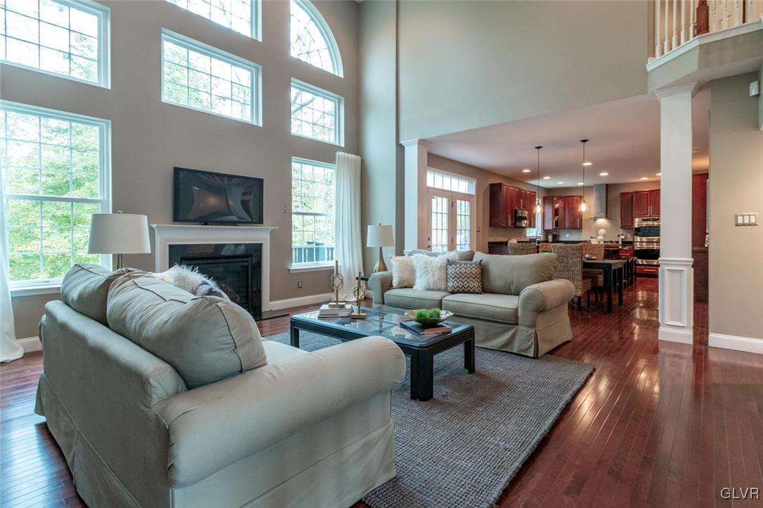3153 Olympic Drive Emmaus, PA 18049 - Photo 11 of 40 a living room with furniture fireplace and a flat screen tv