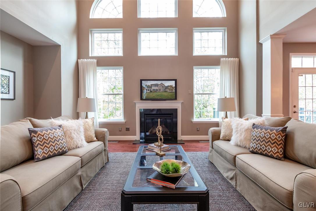 3153 Olympic Drive Emmaus, PA 18049 - Photo 12 of 40 a living room with furniture fireplace and window