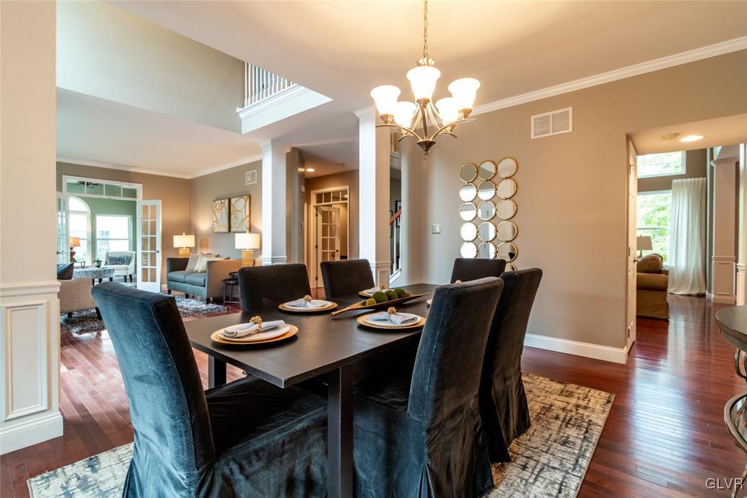 3153 Olympic Drive Emmaus, PA 18049 - Photo 20 of 40 a view of a dining room with furniture wooden floor and chandelier