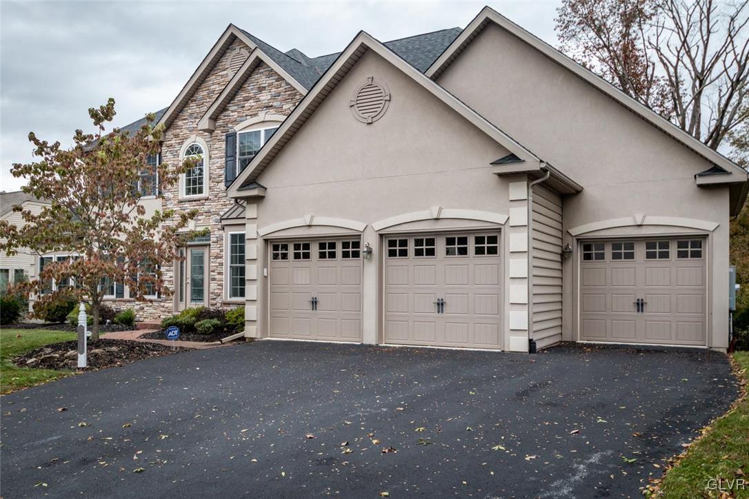 3153 Olympic Drive Emmaus, PA 18049 - Photo 2 of 40 a view of a white house next to a road