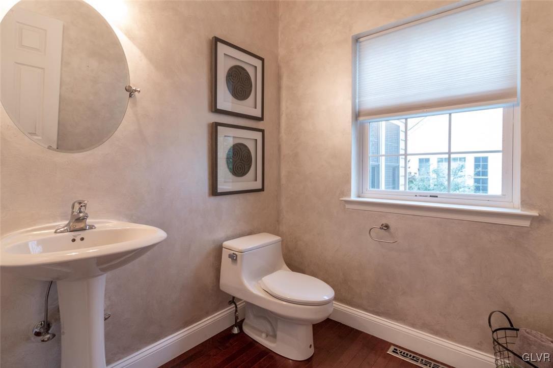 3153 Olympic Drive Emmaus, PA 18049 - Photo 21 of 40 a bathroom with a toilet sink and mirror