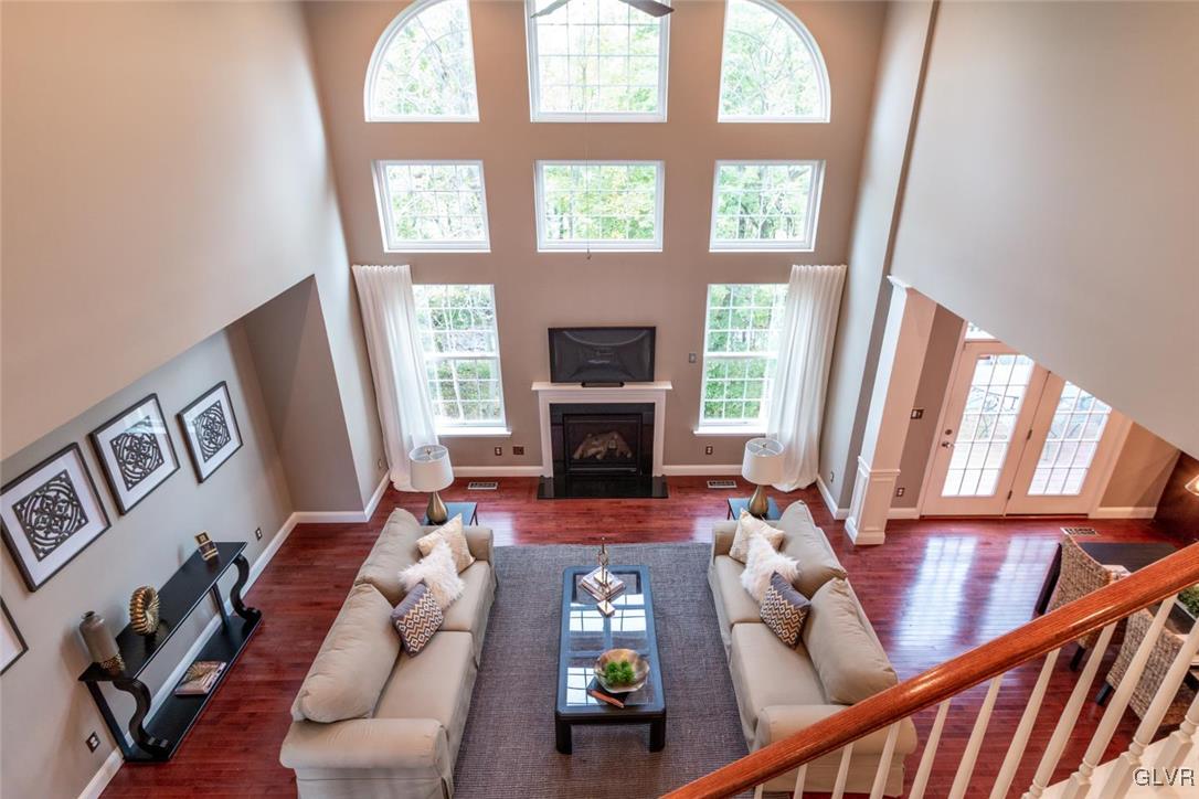 3153 Olympic Drive Emmaus, PA 18049 - Photo 24 of 40 a living room with furniture fireplace and a large window