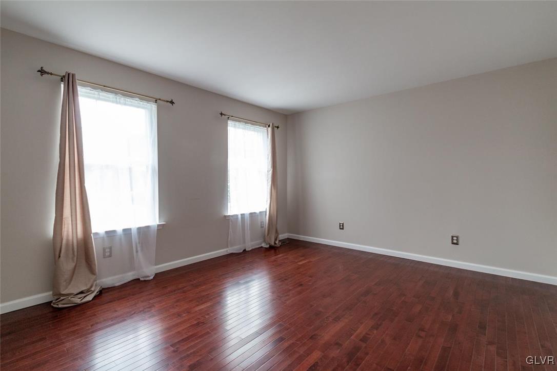3153 Olympic Drive Emmaus, PA 18049 - Photo 28 of 40 an empty room with wooden floor and windows