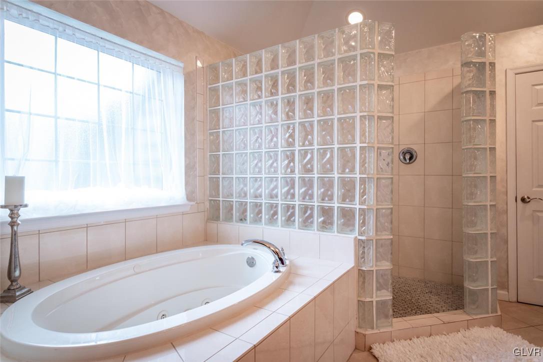 3153 Olympic Drive Emmaus, PA 18049 - Photo 35 of 40 a bathroom with a bathtub and window