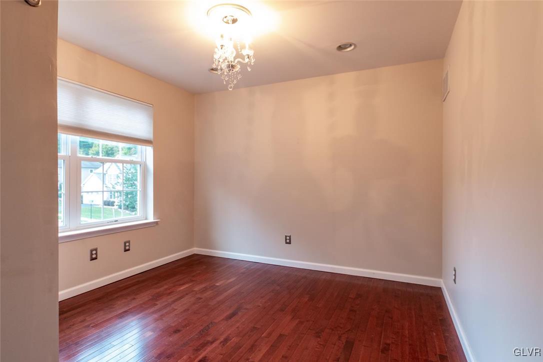 3153 Olympic Drive Emmaus, PA 18049 - Photo 37 of 40 wooden floor in an empty room with a window