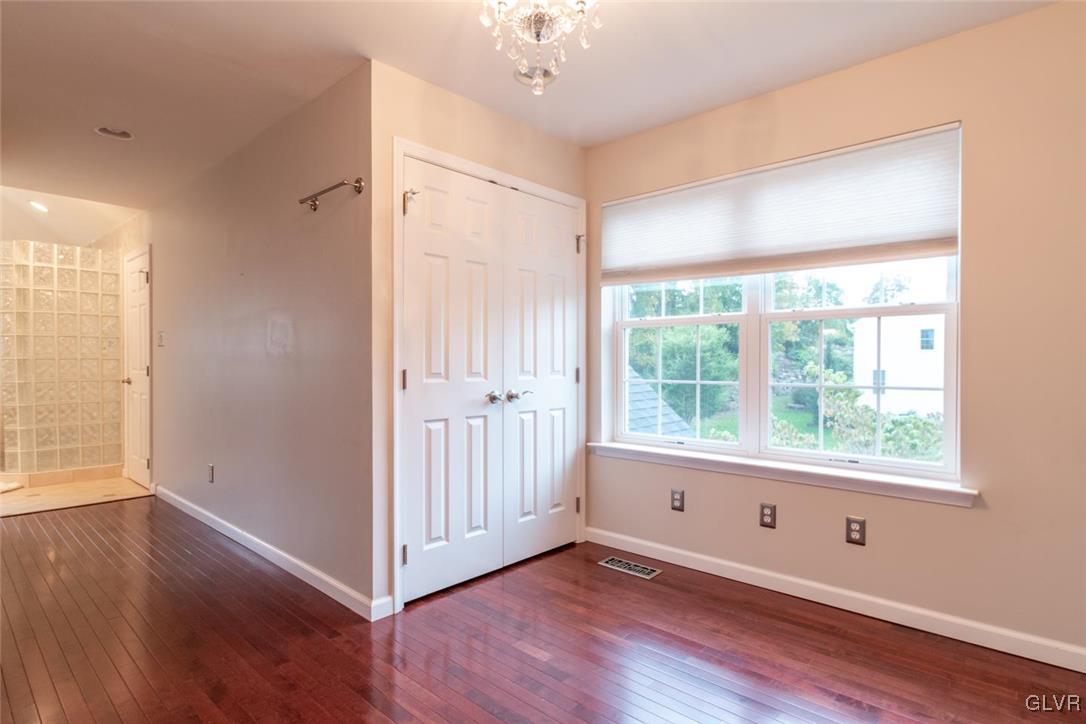3153 Olympic Drive Emmaus, PA 18049 - Photo 38 of 40 a view of an empty room with wooden floor and a window