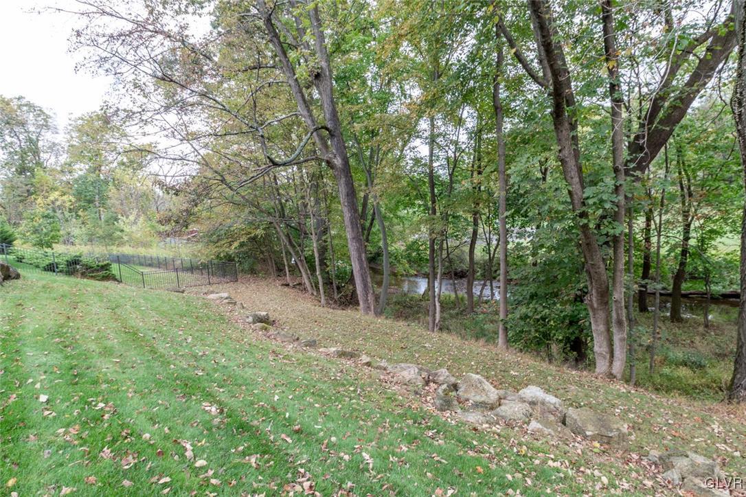 3153 Olympic Drive Emmaus, PA 18049 - Photo 4 of 40 a view of a forest with trees in the background
