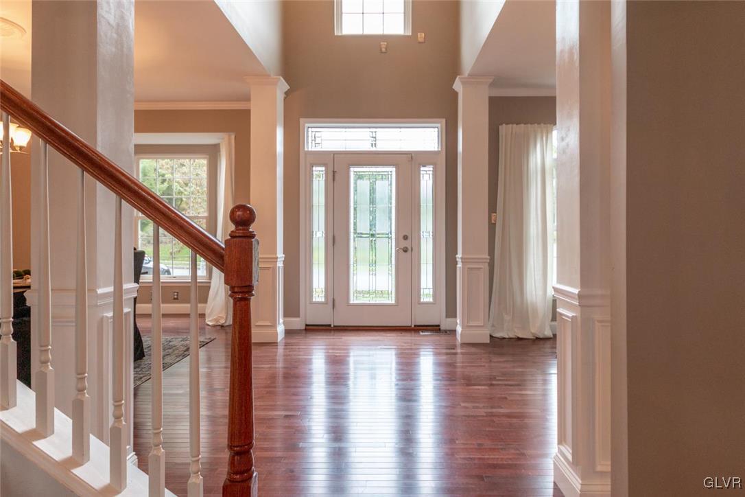 3153 Olympic Drive Emmaus, PA 18049 - Photo 5 of 40 a view of an entryway with wooden floor and stairs