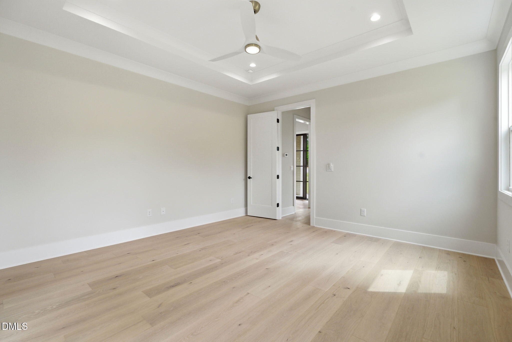 1304 Sanctuary Pond Drive Raleigh, NC 27606 - Photo 19 of 52 a view of an empty room with wooden floor