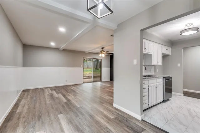 a view of a kitchen with a stove cabinets and wooden floor