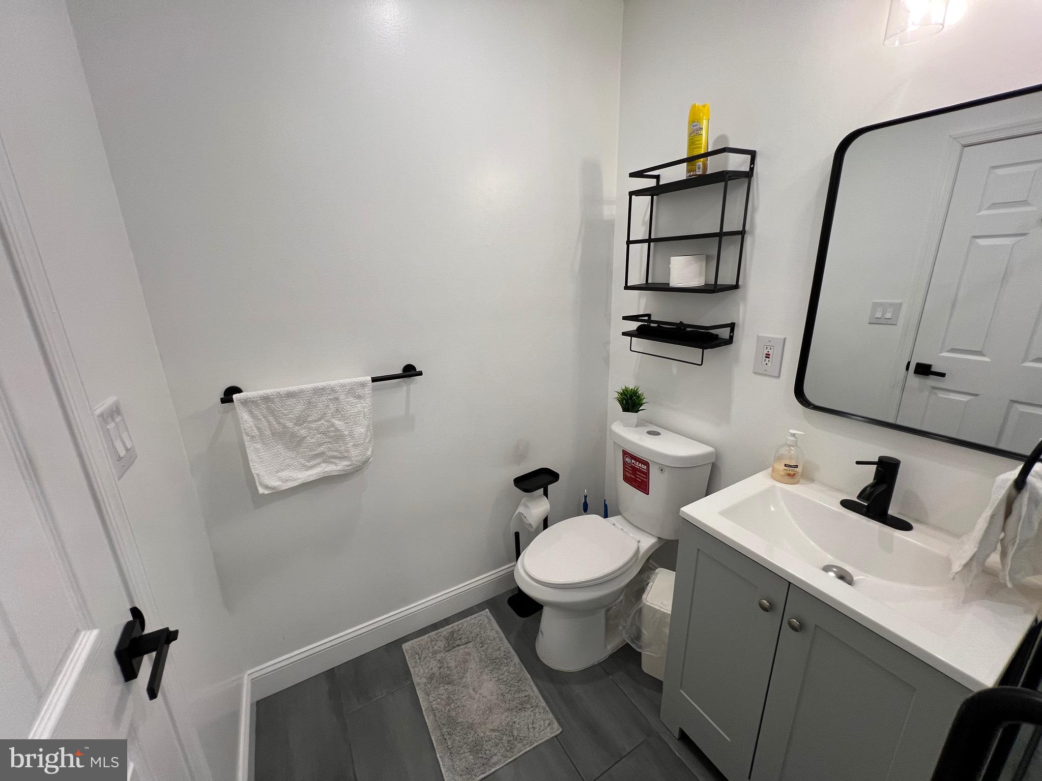 1985 North 63rd Street, Unit 2 Philadelphia, PA 19151 - Photo 12 of 23 a bathroom with a sink toilet and vanity