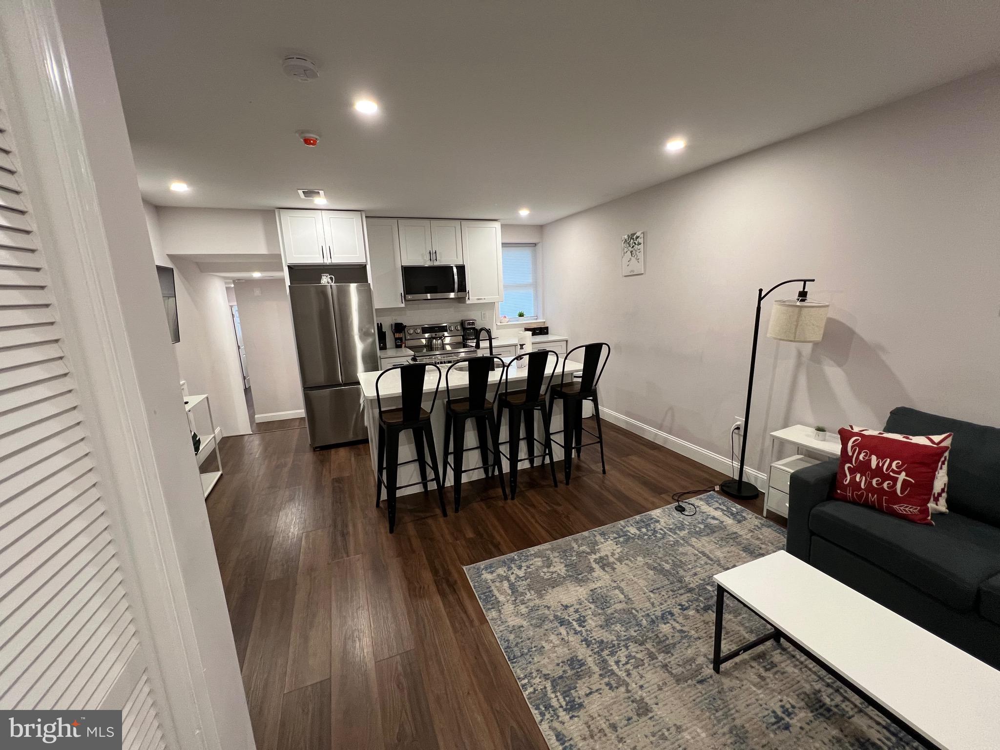 1985 North 63rd Street, Unit 2 Philadelphia, PA 19151 - Photo 4 of 23 a view of a dining room with furniture and wooden floor