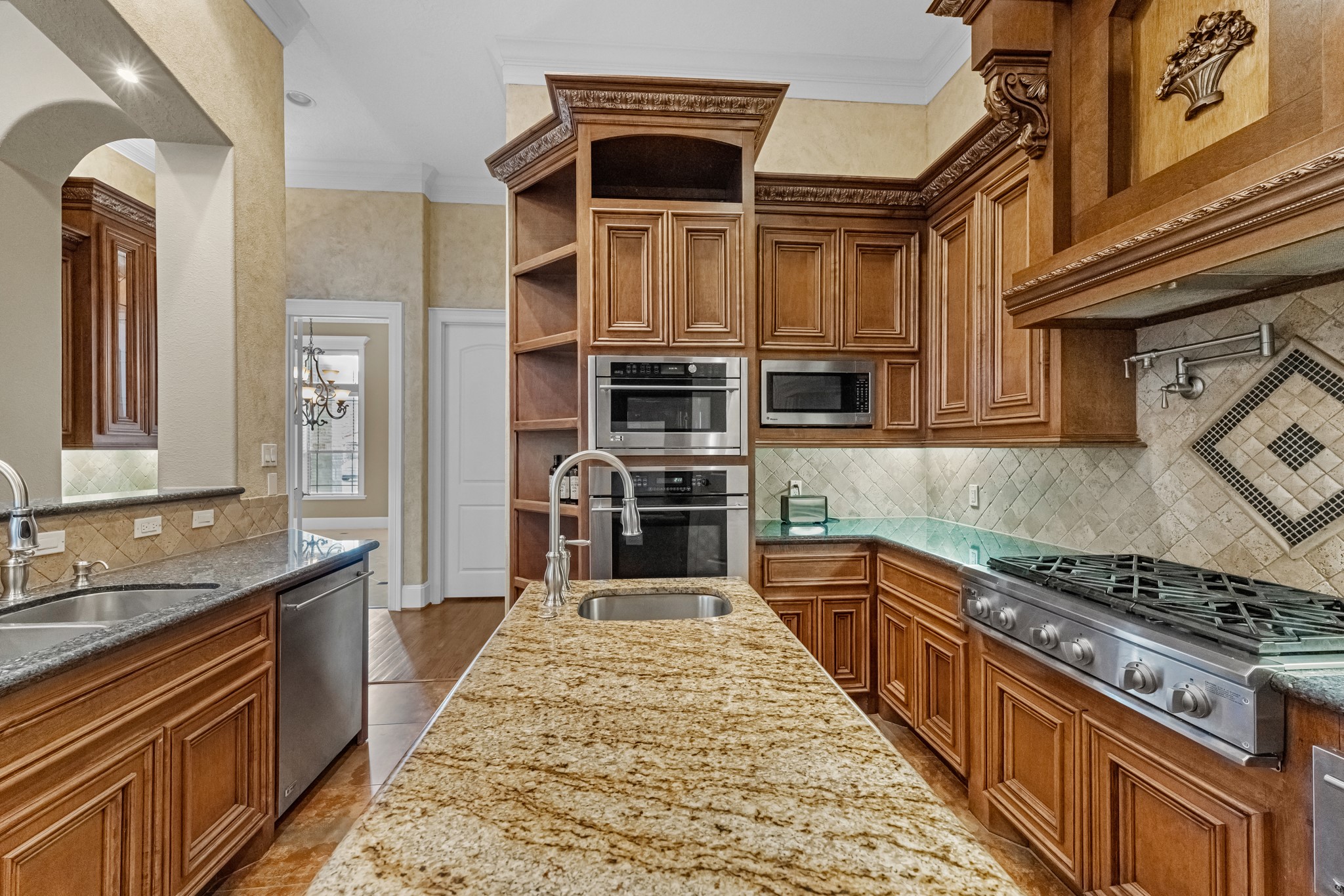 5411 Leopold Drive Houston, TX 77021 - Photo 10 of 50 a kitchen with stainless steel appliances granite countertop a stove and a sink