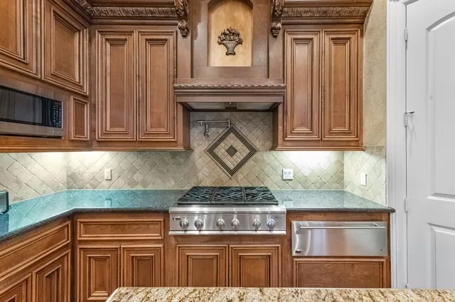 a bathroom with a tub a sink and a mirror