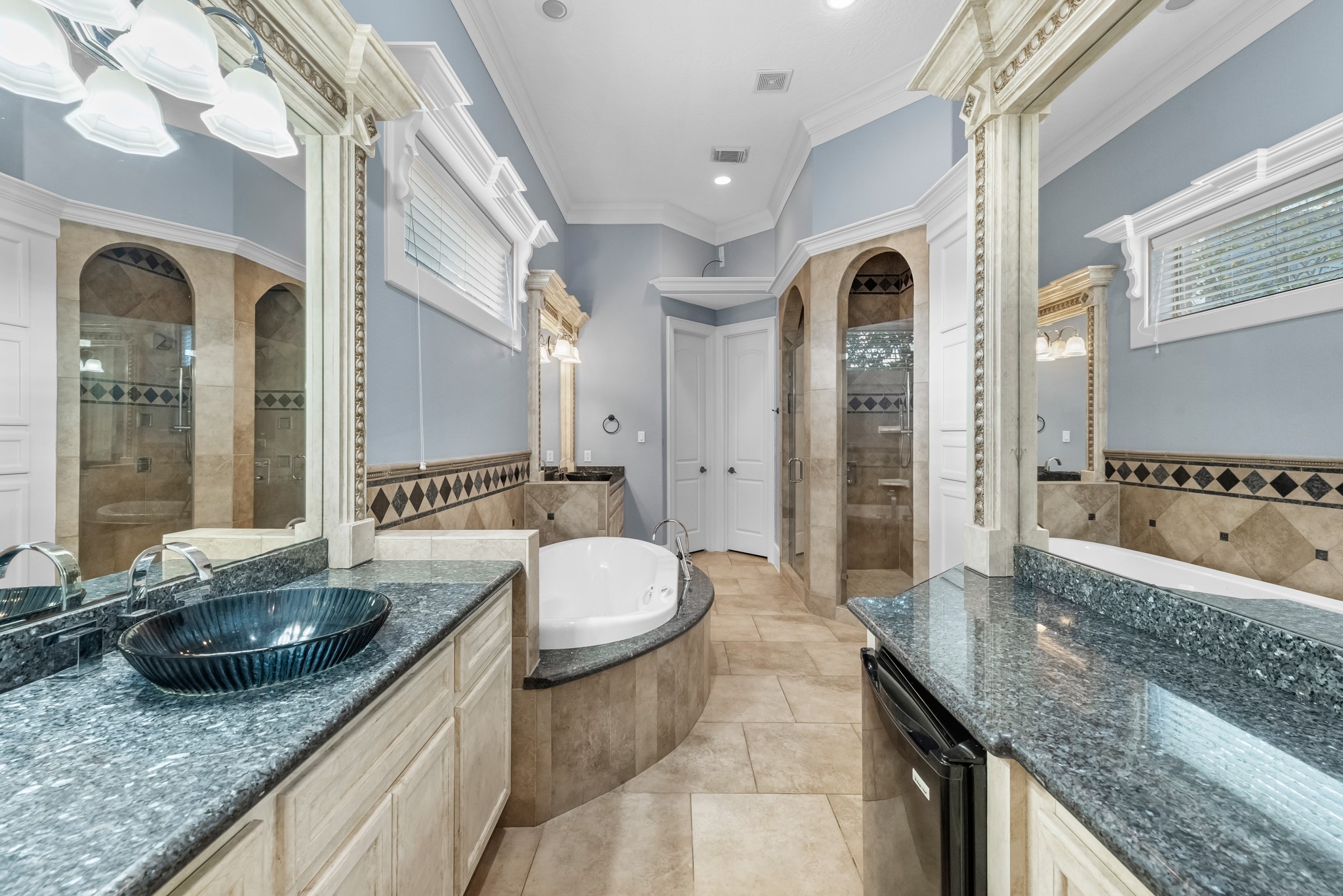 5411 Leopold Drive Houston, TX 77021 - Photo 17 of 50 a bathroom with a granite countertop sink a toilet a mirror and bathtub
