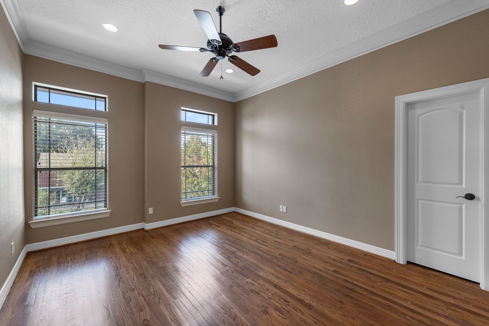 5411 Leopold Drive Houston, TX 77021 - Photo 26 of 50 a view of an empty room with wooden floor and a window