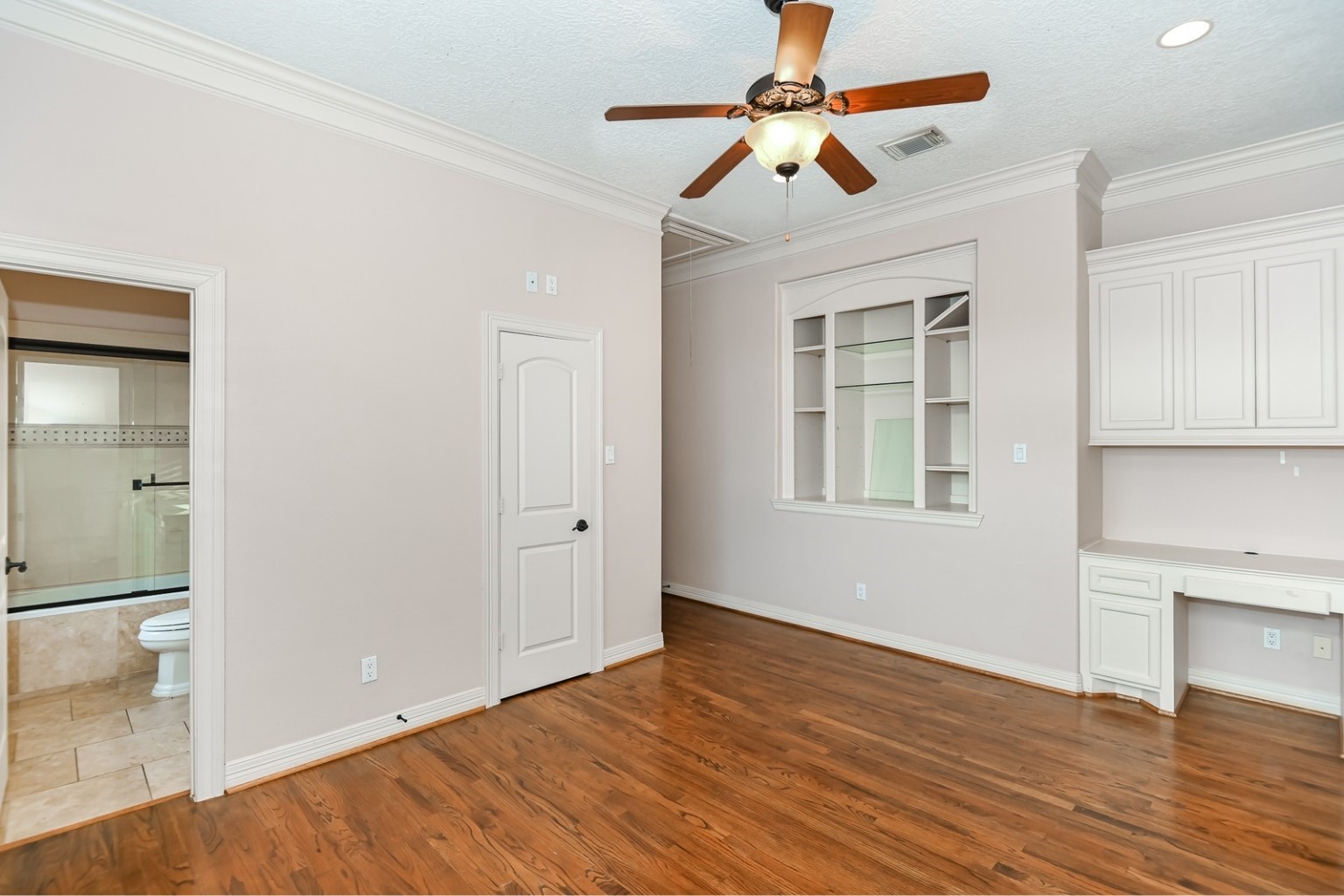 5411 Leopold Drive Houston, TX 77021 - Photo 28 of 50 a view of an empty room with window and wooden floor