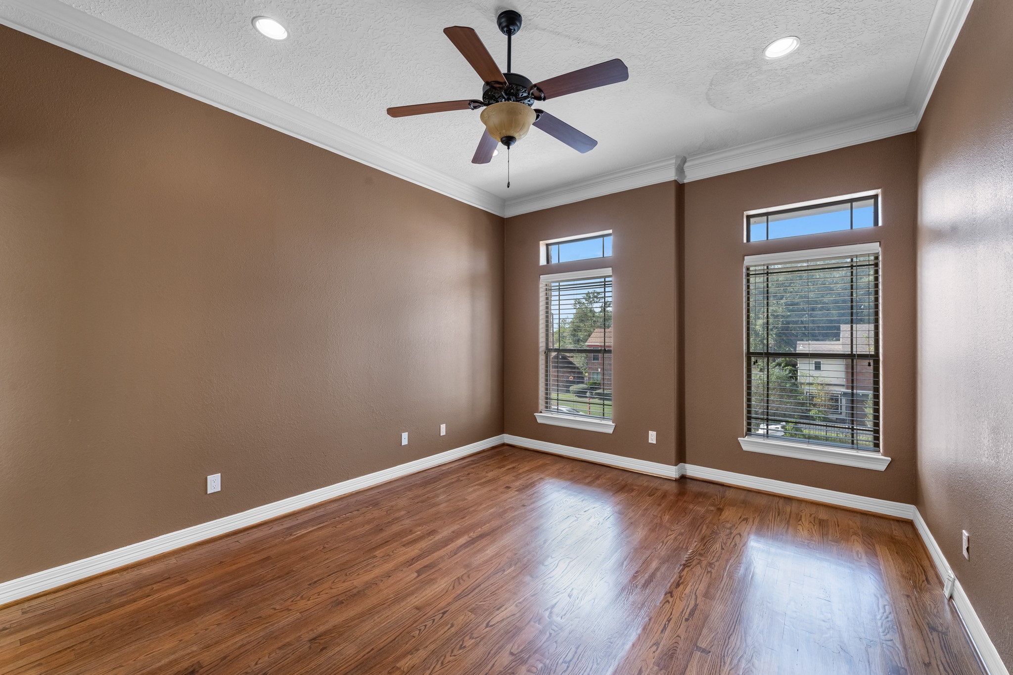 5411 Leopold Drive Houston, TX 77021 - Photo 29 of 50 an empty room with wooden floor and windows