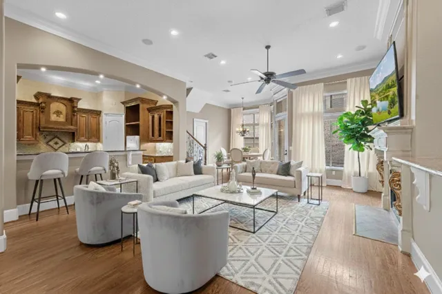 a living room with furniture potted plant and a fireplace