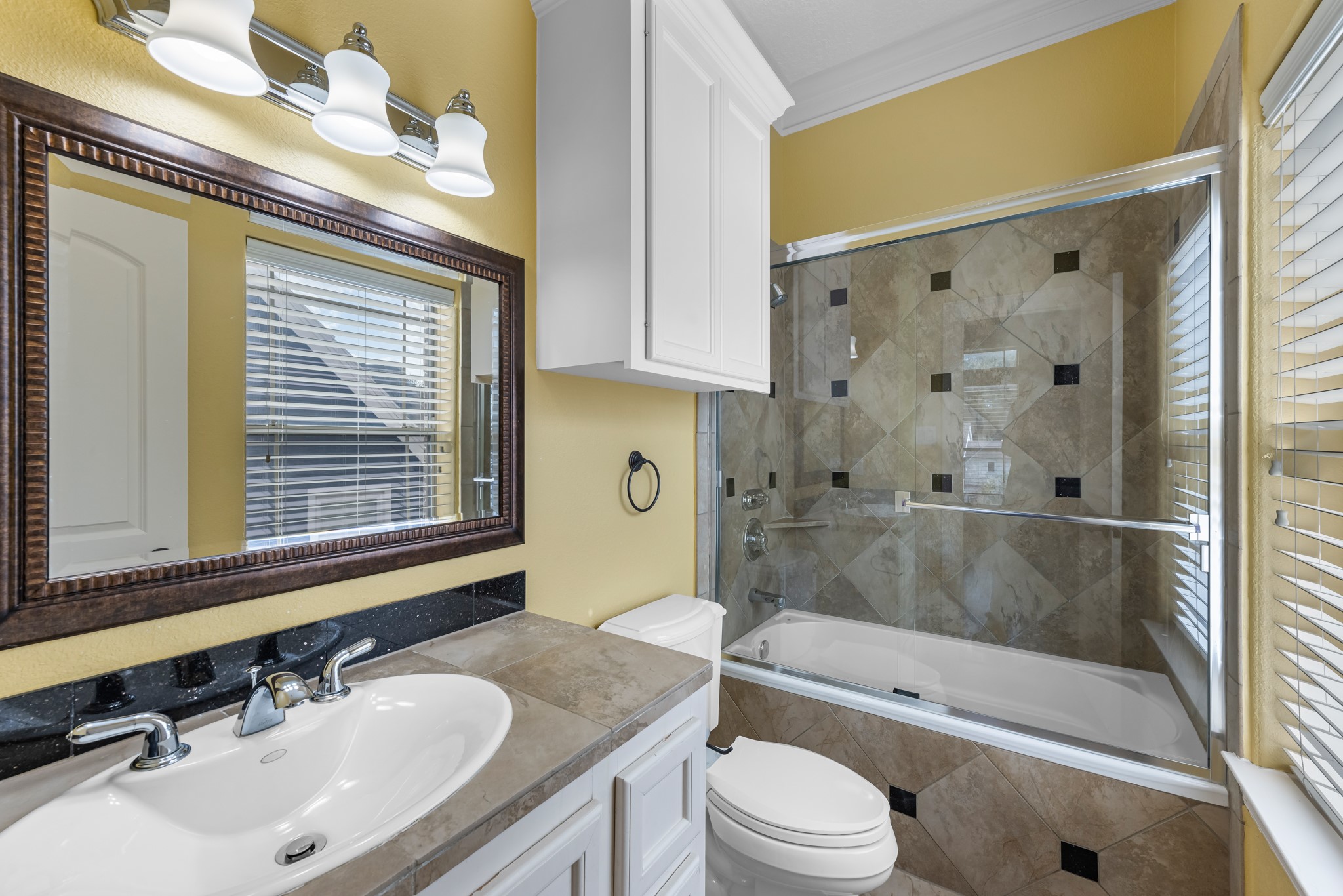 5411 Leopold Drive Houston, TX 77021 - Photo 32 of 50 a bathroom with a granite countertop sink toilet and shower