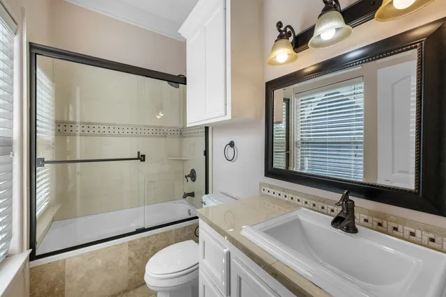 an aerial view of residential house with outdoor space and swimming pool