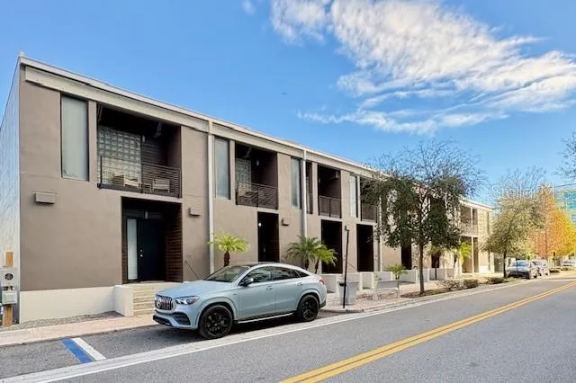 a view of a car parked in front of a building