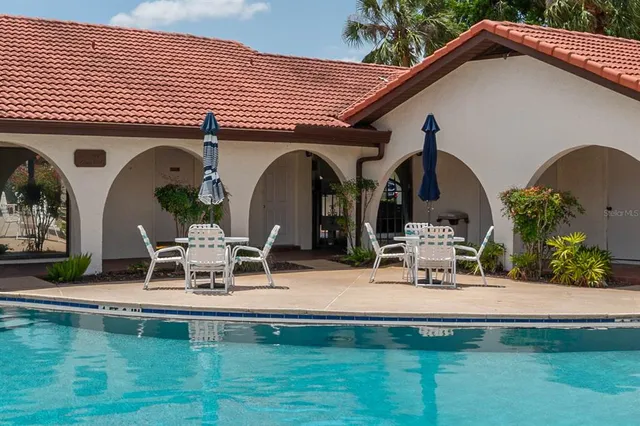 a view of a swimming pool with a patio
