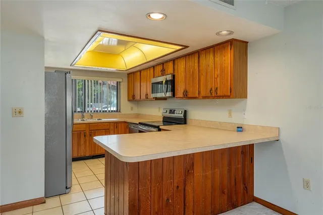 a utility room with sink a washer and dryer