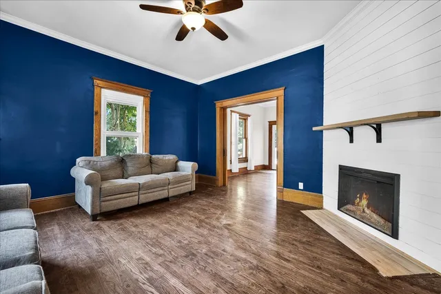 a living room with furniture and a fireplace