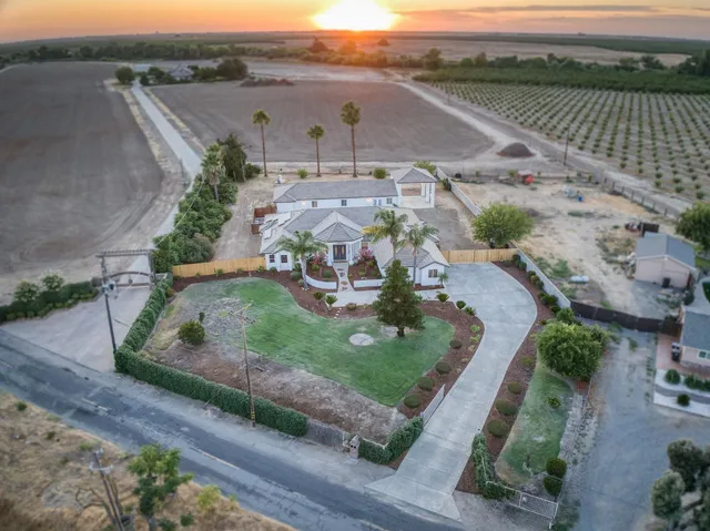 a view of a livingroom with wooden floor and a window