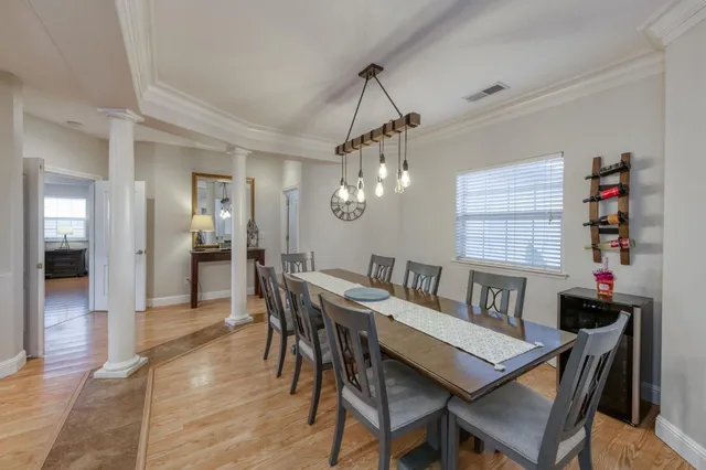 a bathroom with a granite countertop sink two mirror and shower