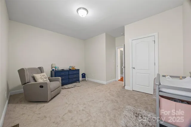 an empty room with cabinet and a projector