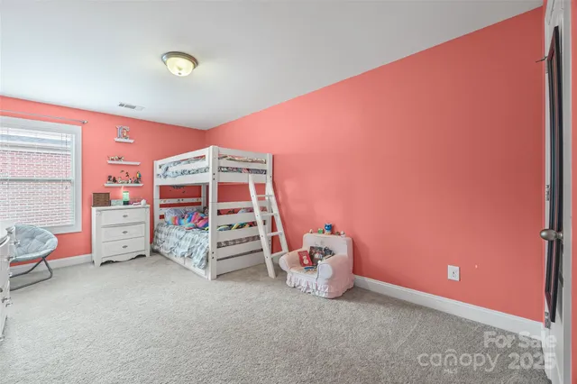 a bedroom with bed and a window