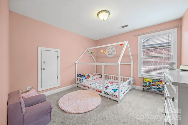 a bedroom with furniture and a window